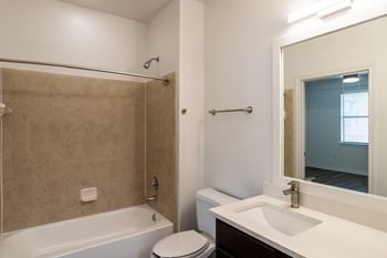 Bathroom with bathtub and shower